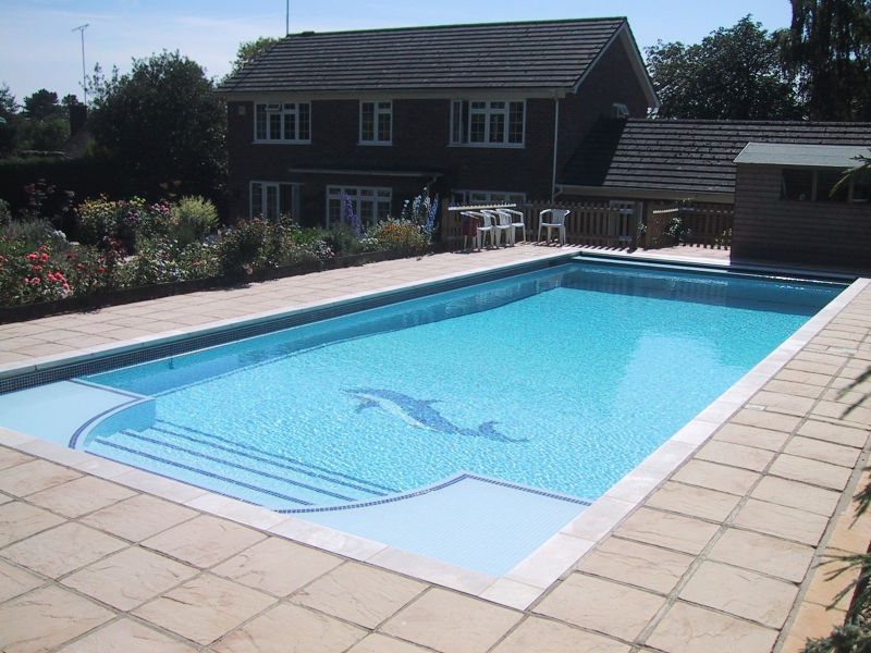 Dolphin motif with classical blue mosiac tiles and an automatic safety cover