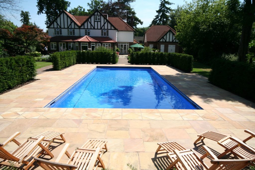 Blue mosaic tiles with dark blue tile band and marker lines, quadrant steps, sandstone paving and coping stones