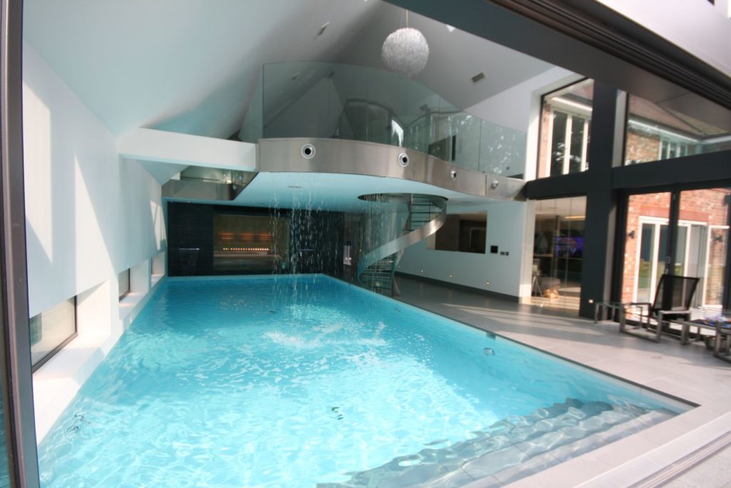 Ceiling waterfall and wall fountains feature in this Bronze Award British Pool & Hot Tubs Residential Indoor Pool 2016